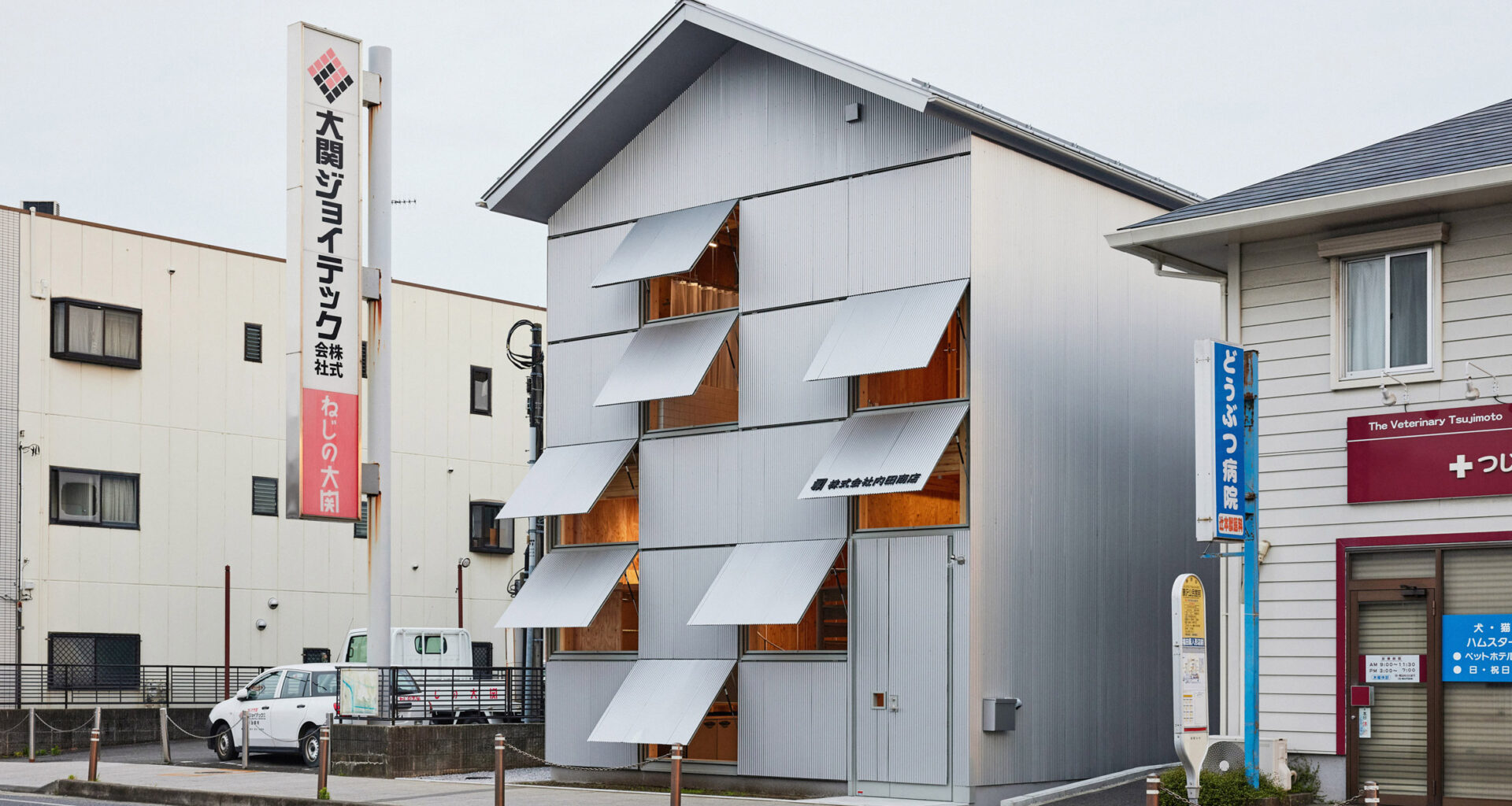 Office with steel-shutter facade