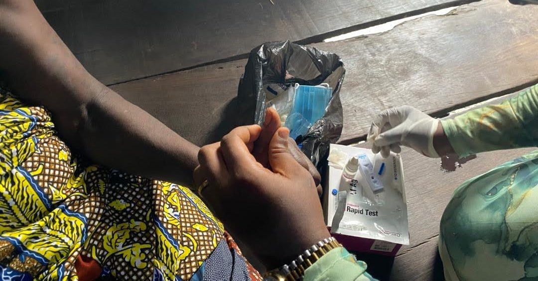 Malaria test on a woman in Makoko