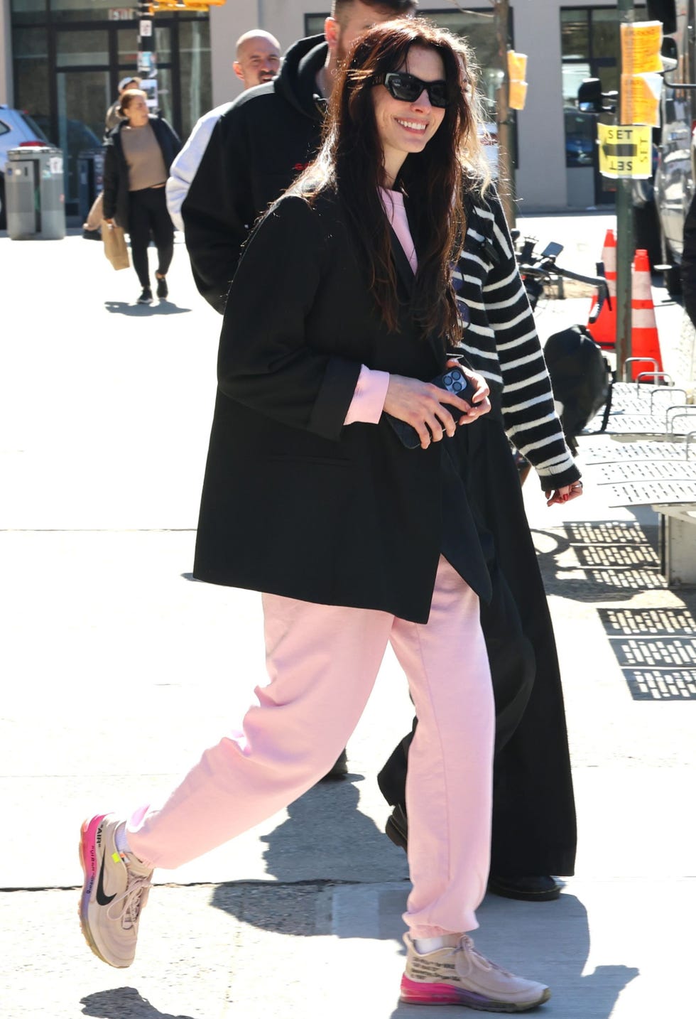 person walking in casual attire on a city street person walking in casual attire on a city street