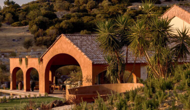 lime-washed facade in terracotta tones enfolds urla family home in turkey