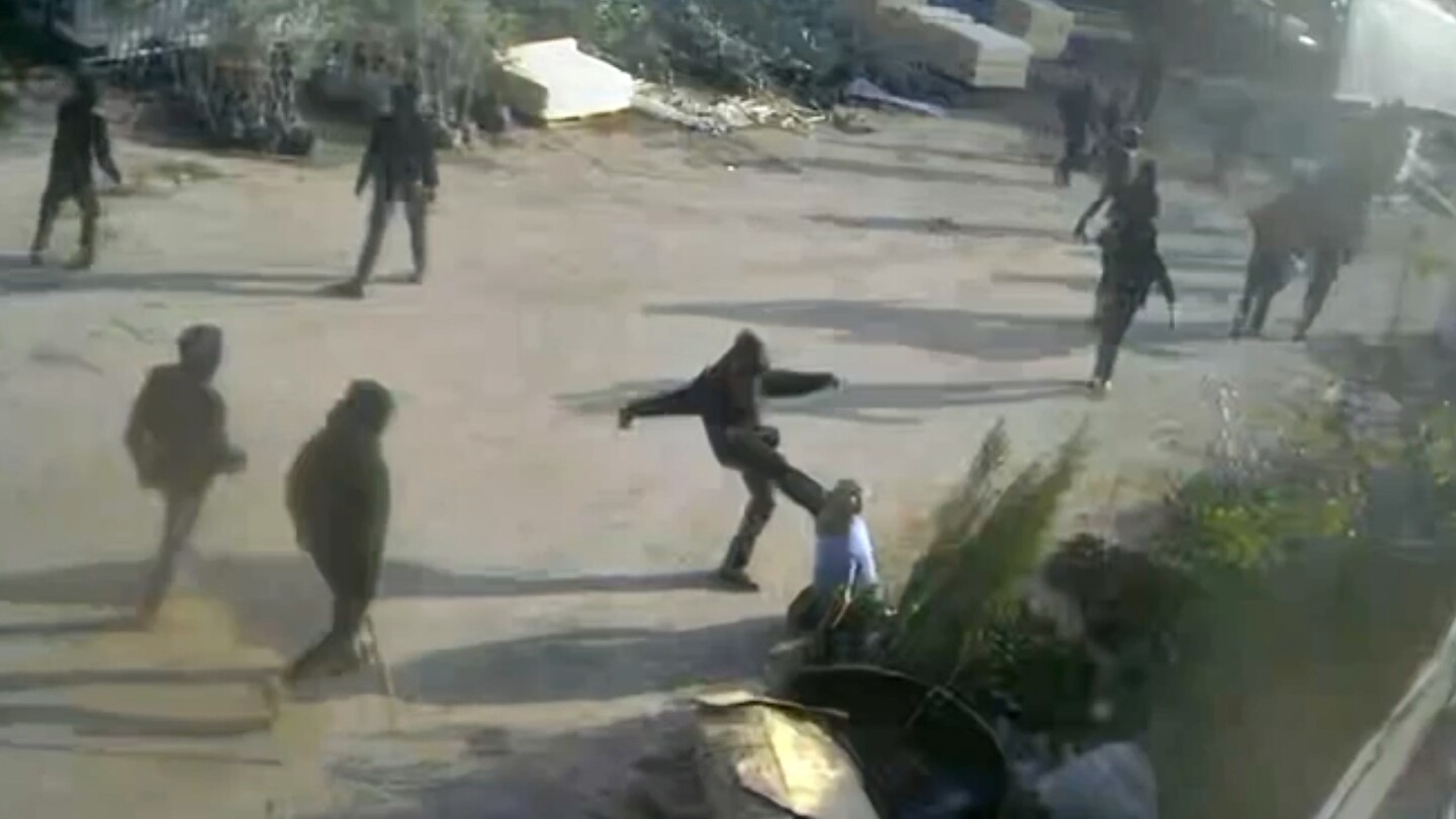 Video shows masked, armed men beating a Palestinian in the occupied West Bank