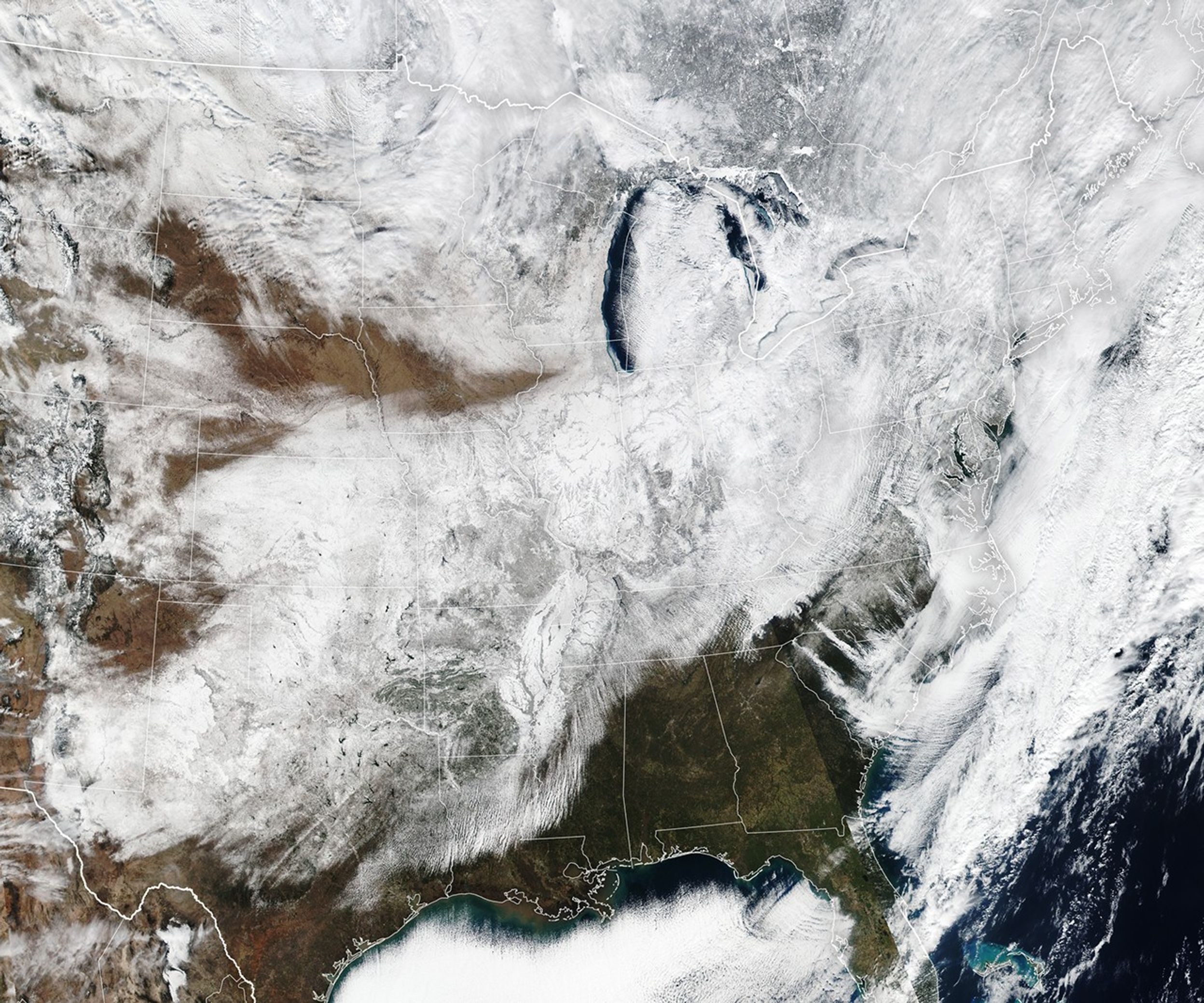 Much of the central, Midwest, and northeast United States is covered in a layer of white snow.