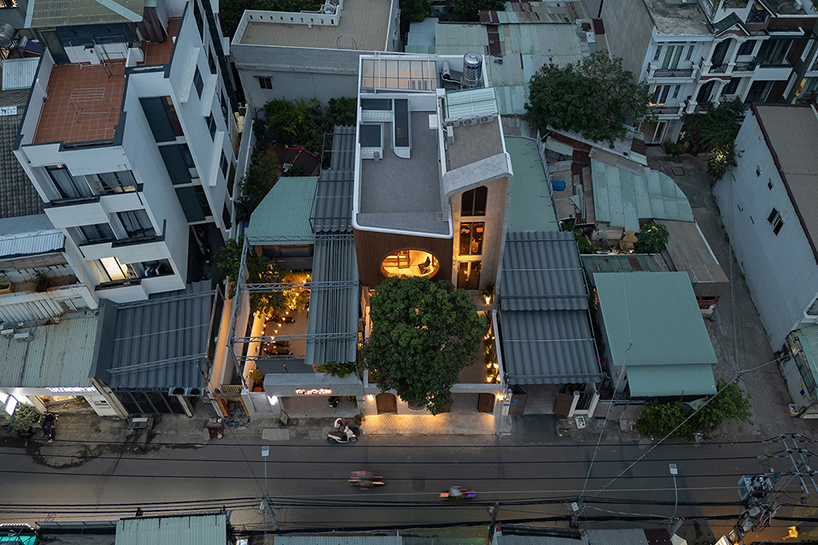 vespa-inspired curved geometry shapes vietnam residence clad in wood