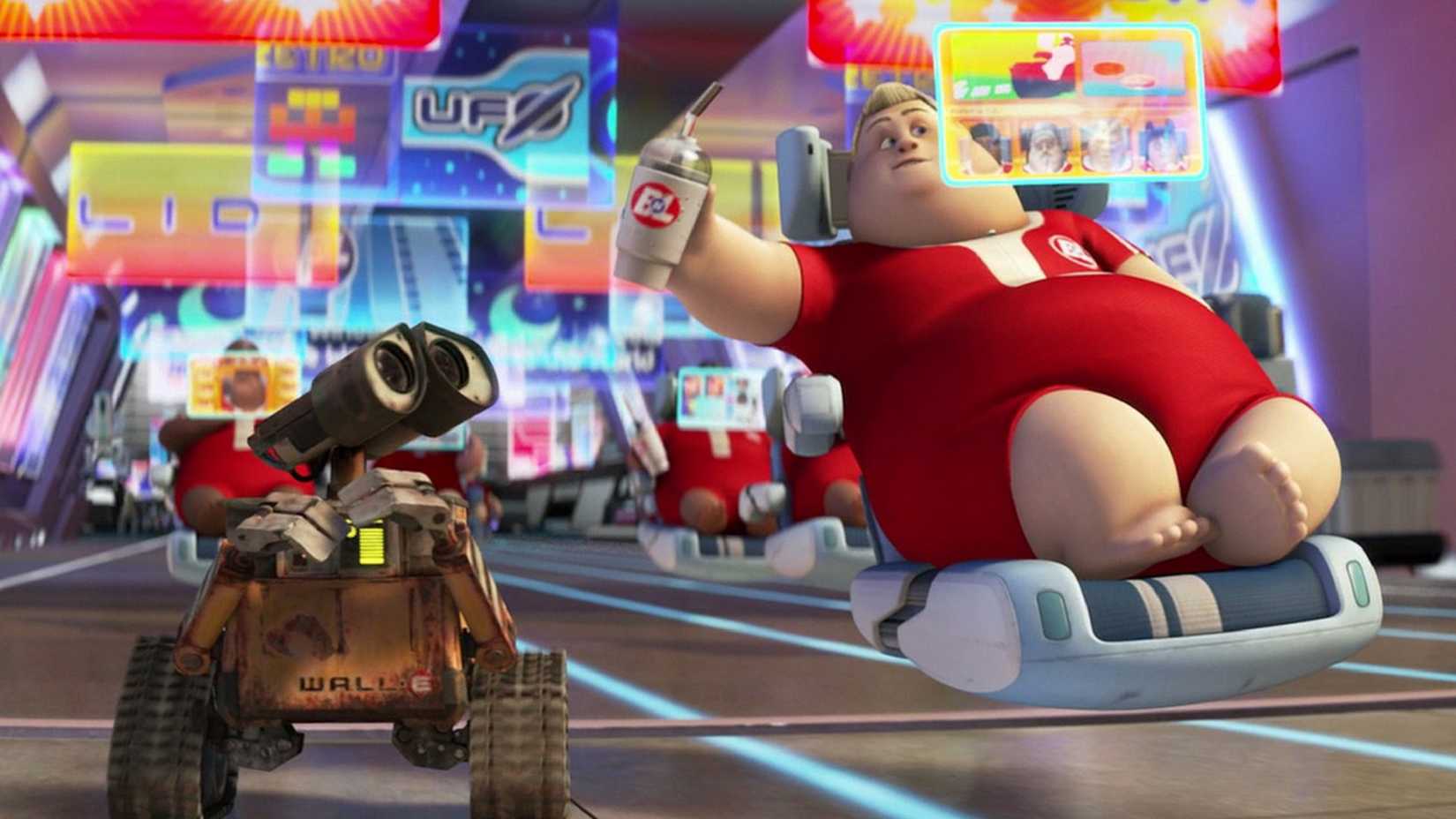 A man in a hoverchair tries to give a drink to Wall-e in Wall-E