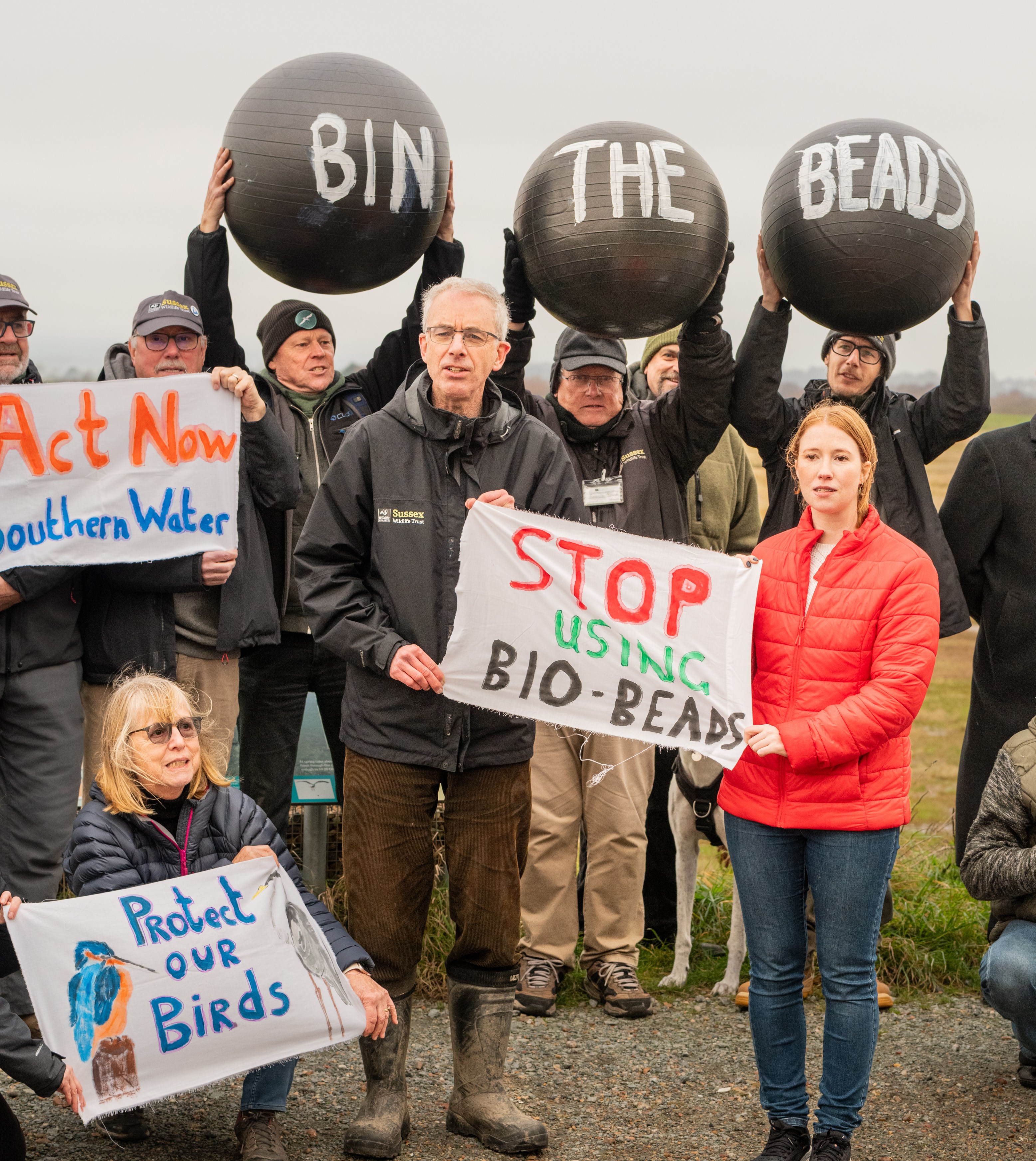 People protesting plastic pollution at Rye Harbour Nature Reserve.