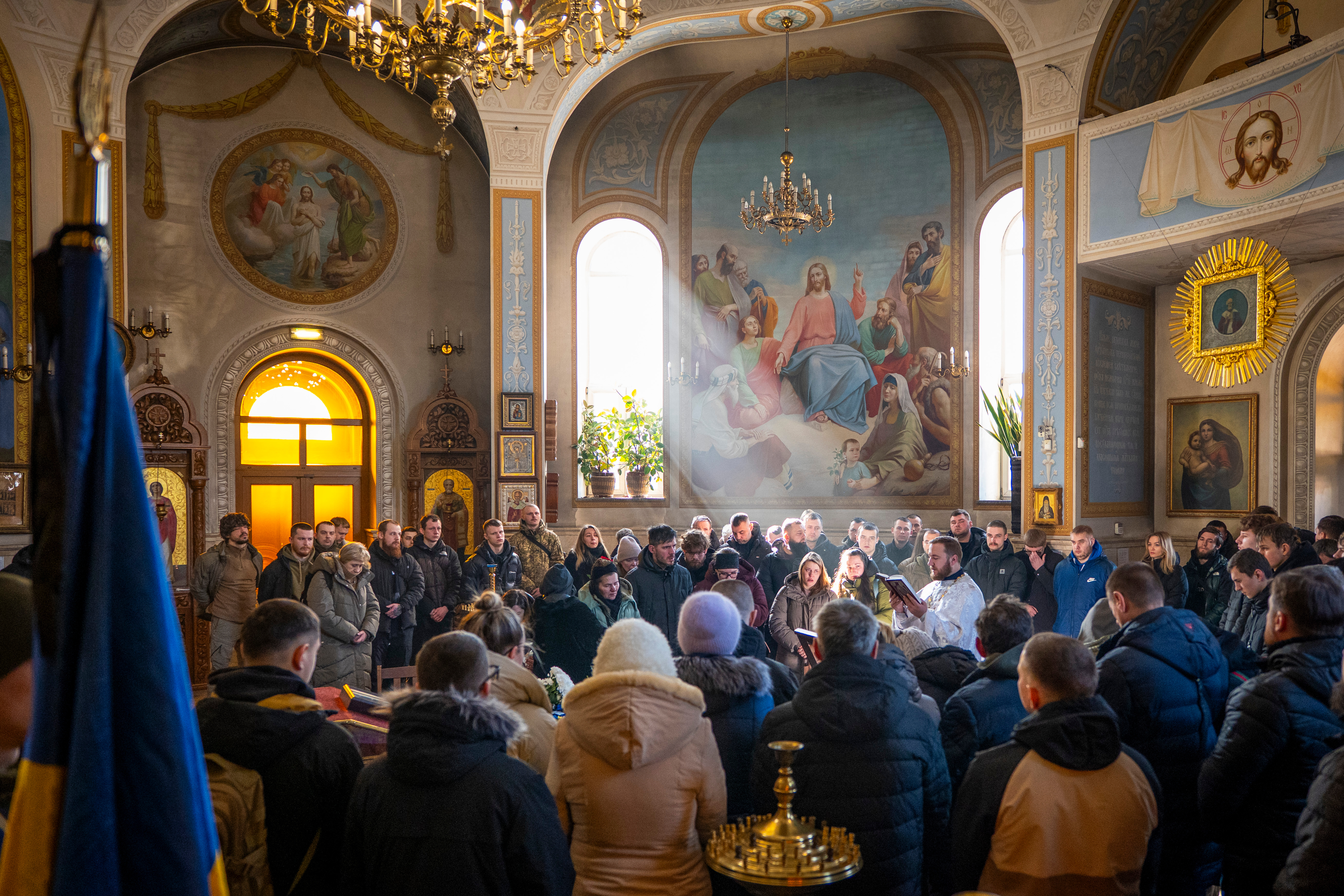 People attending the funeral ceremony for Ukrainian soldier Alexander Krasikov at the Church of St. Peter and Paul in Kyiv.