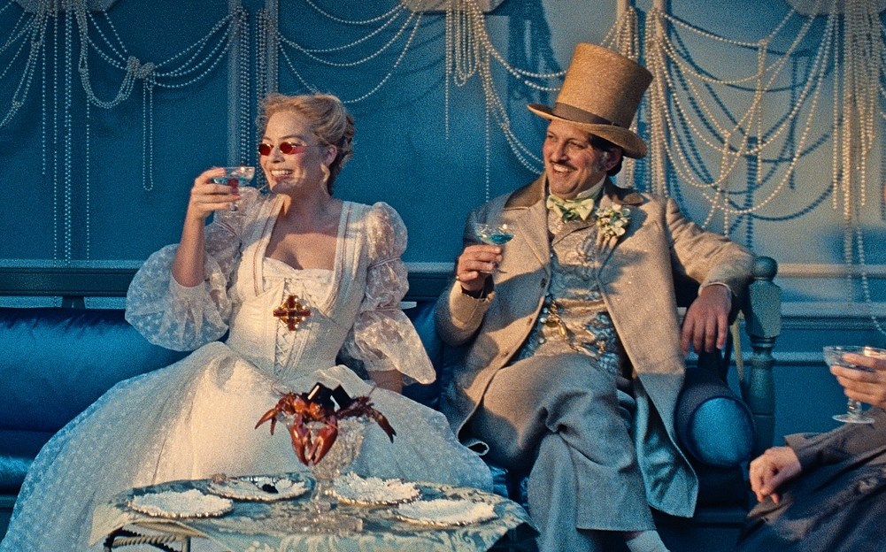 Margot Robbie as Catherine Earnshaw and Shazad Latif as Edgar Linton in "Wuthering Heights."