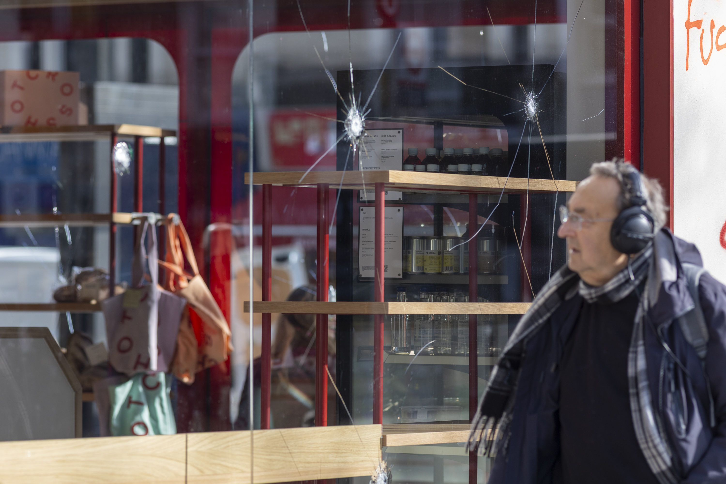 Shattered window of a Gail's bakery branch with anti-Semitic graffiti.