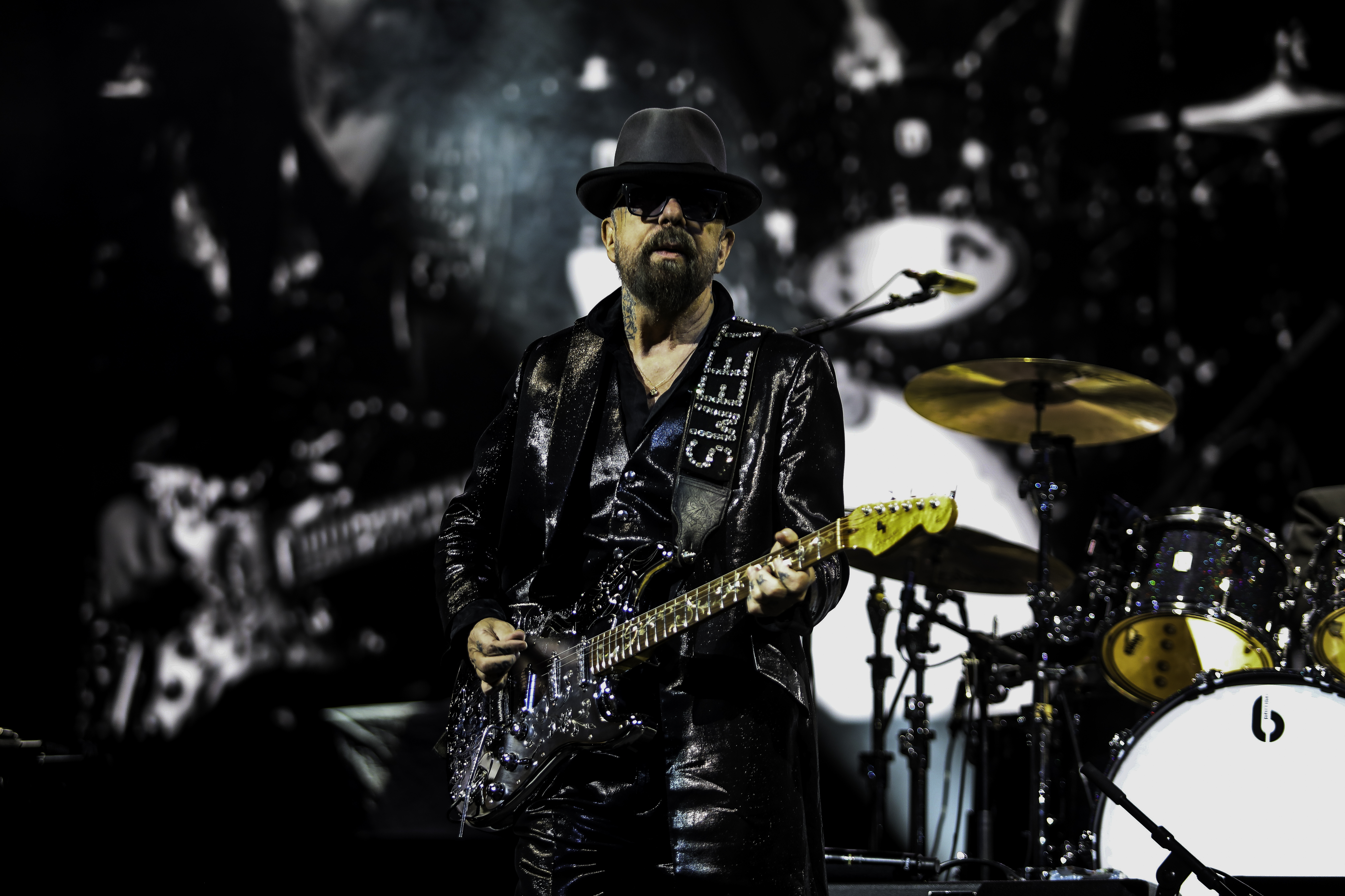 Dave Stewart of Eurythmics playing guitar on stage.