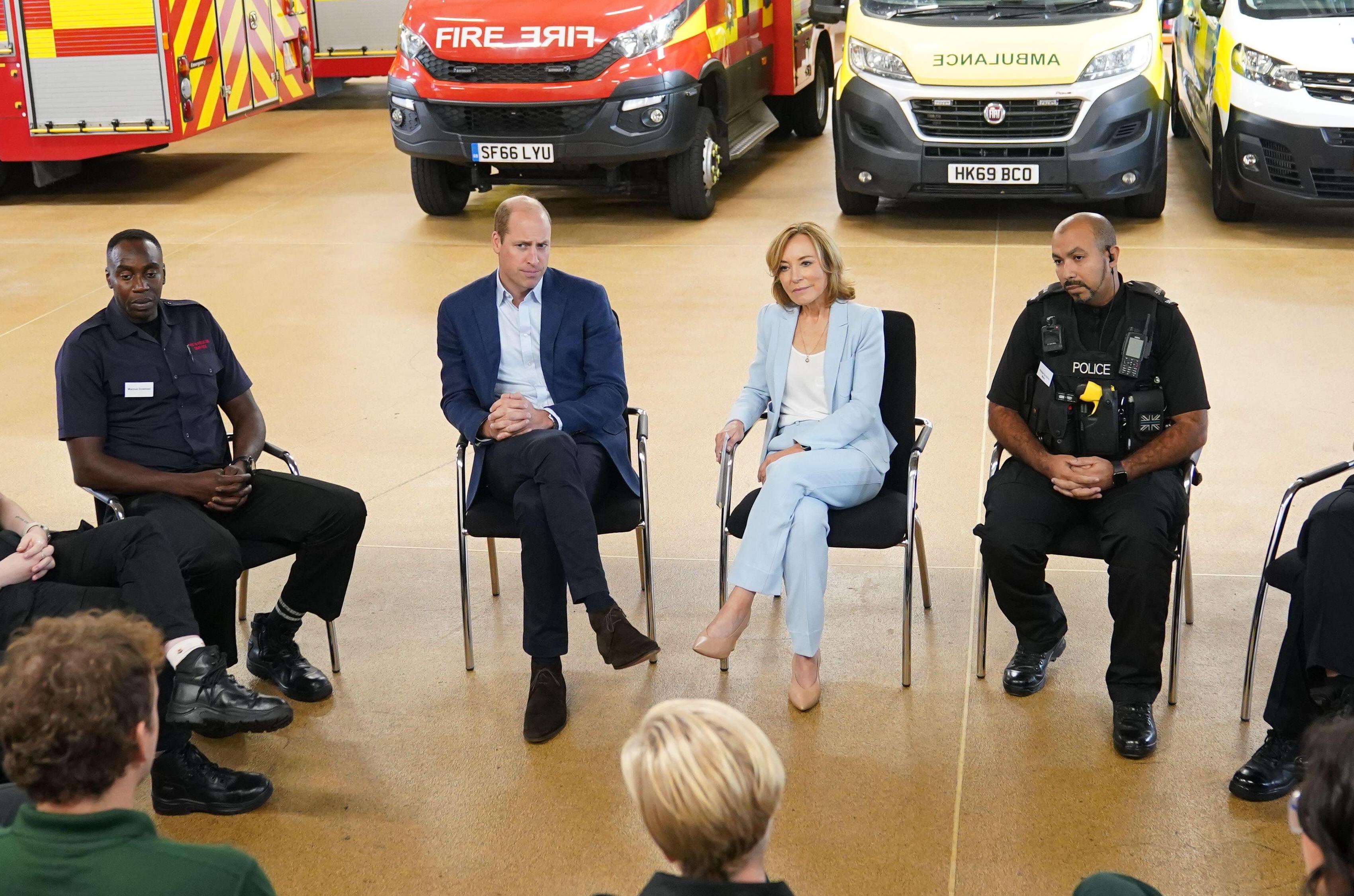 The Prince of Wales, with Dr Sian Williams, talking to staff during a visit to the Milton Keynes Blue Light Hub in Buckinghamshire, to highlight the importance of supporting the mental health of emergency responders during the week of World Mental He