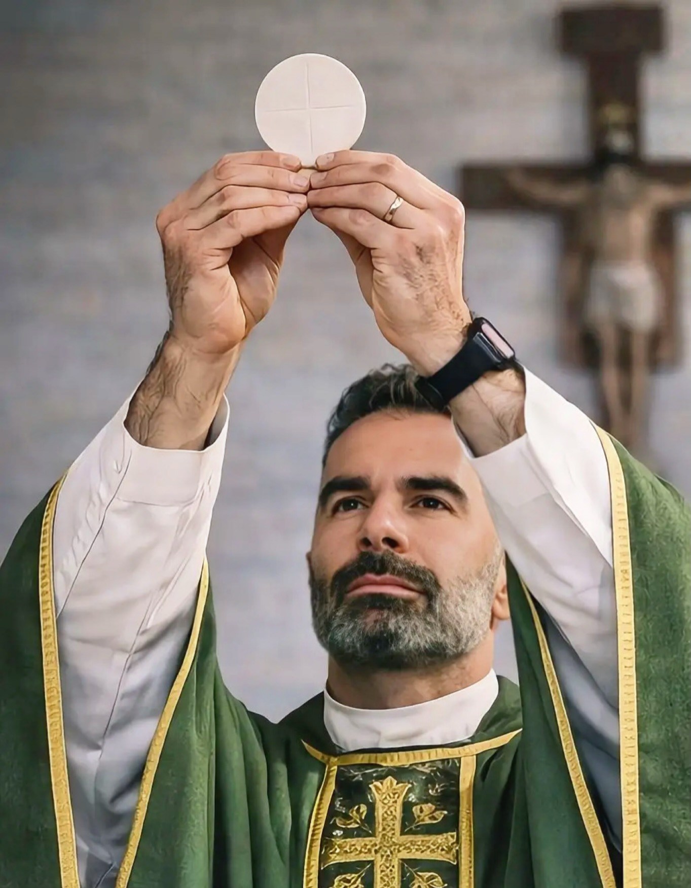 A priest holding up a communion wafer during a religious service.