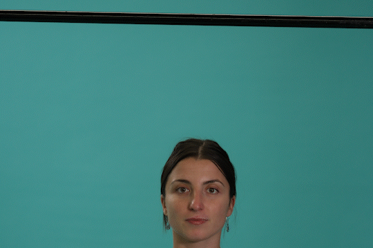 Woman demonstrating assisted dead hangs.