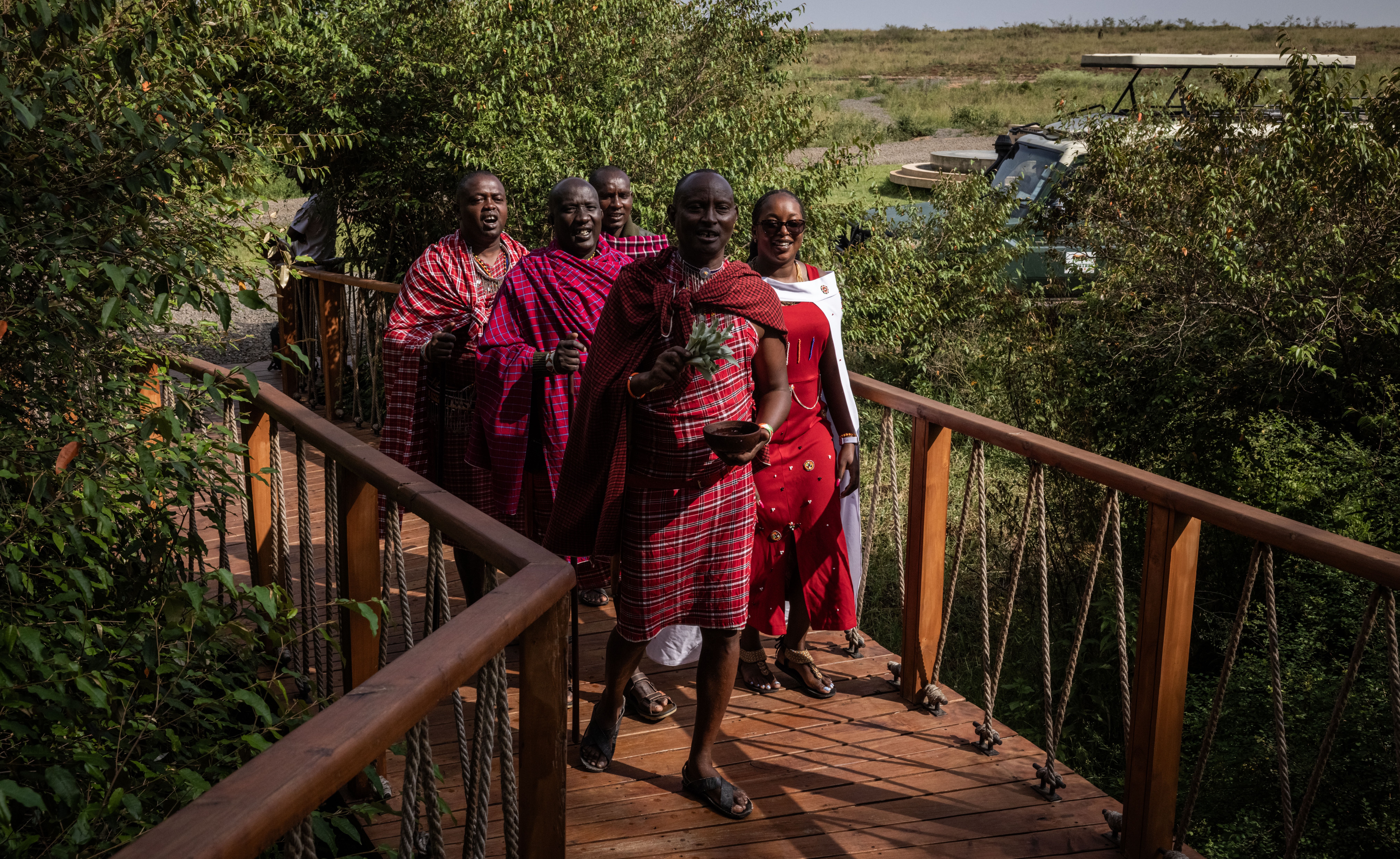 Masai men and a cultural ambassador welcome journalists to the Ritz-Carlton Safari Camp.