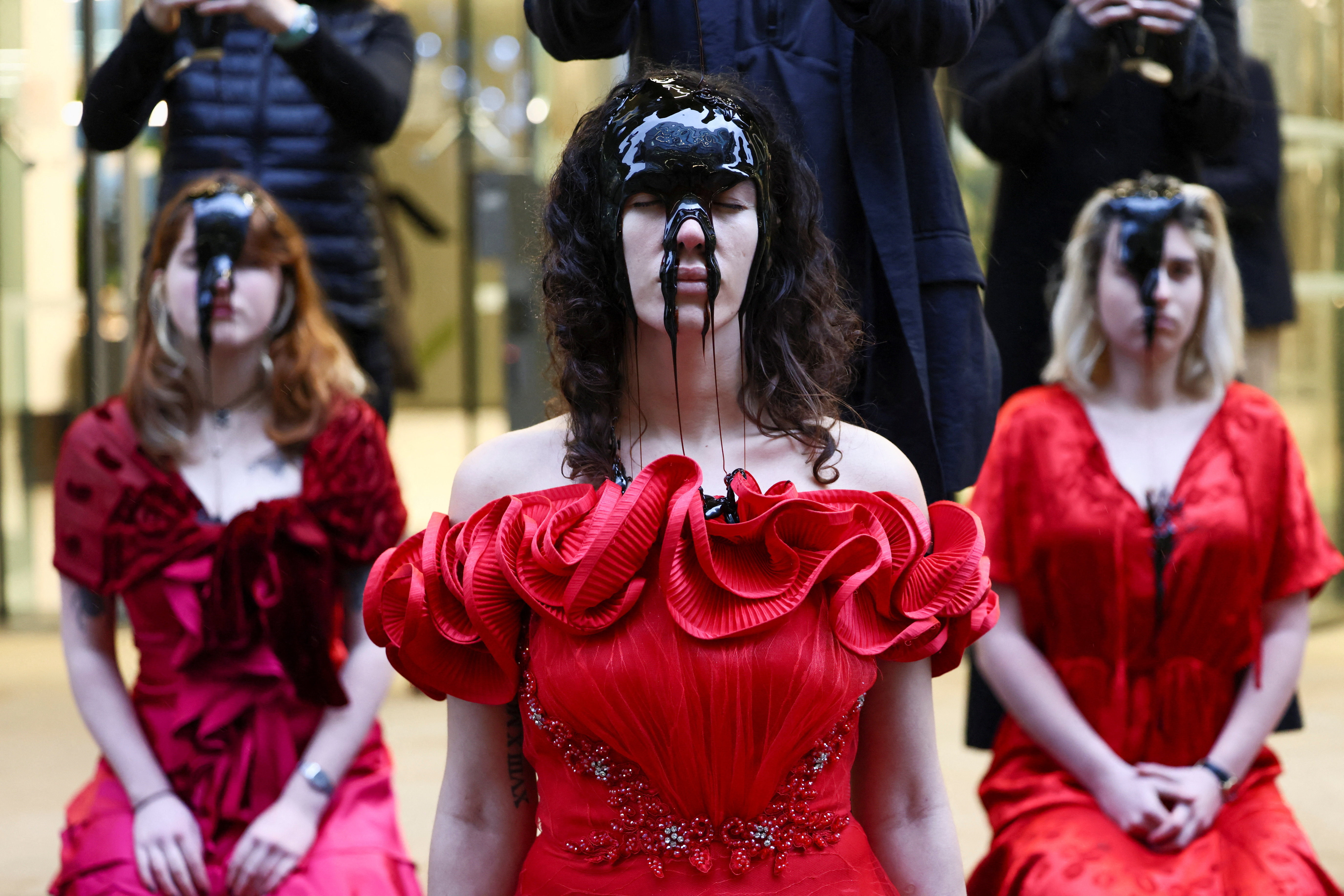 Activists stage an 'oil spill' protest, in London