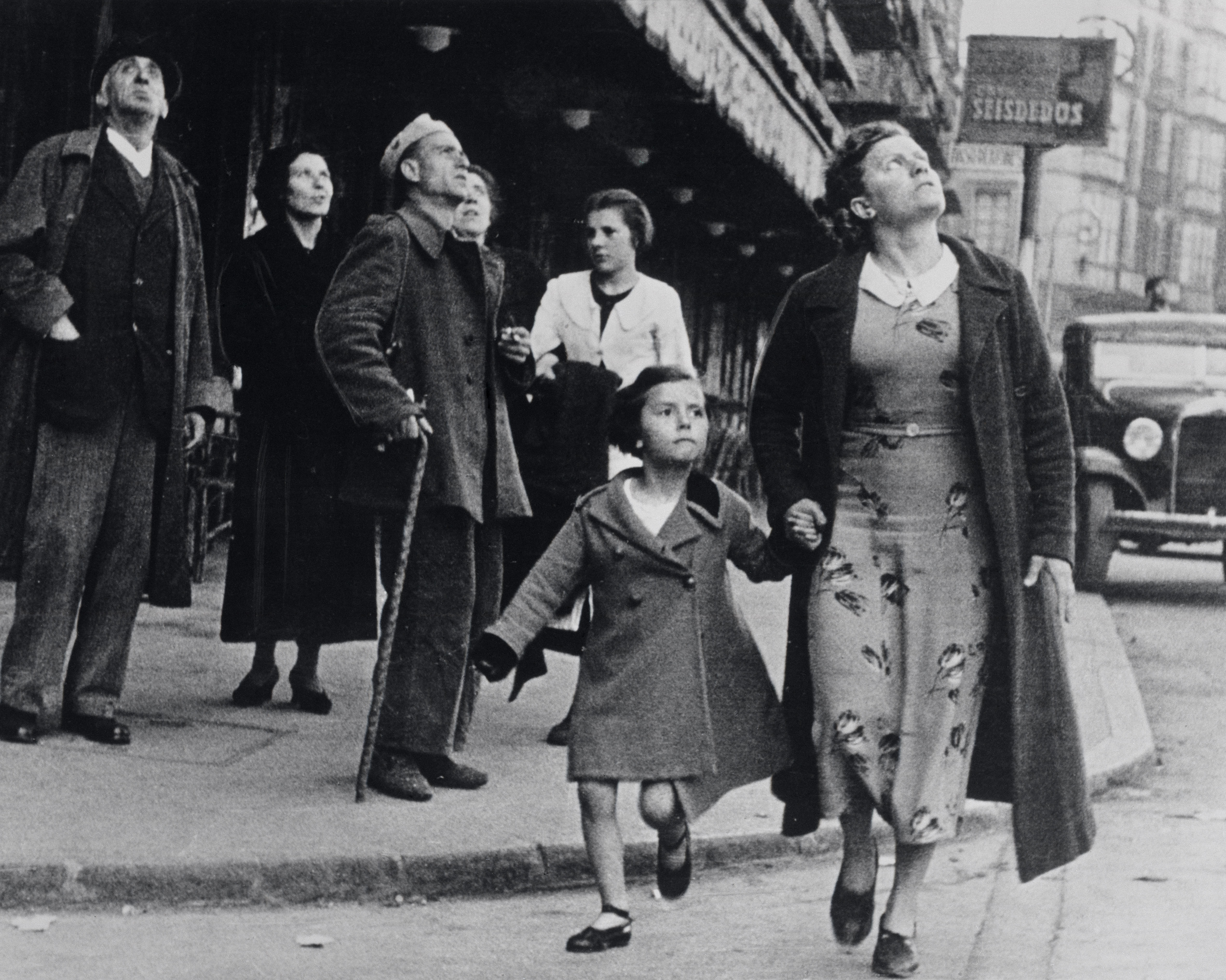 People in Bilbao running for shelter during an air-raid.