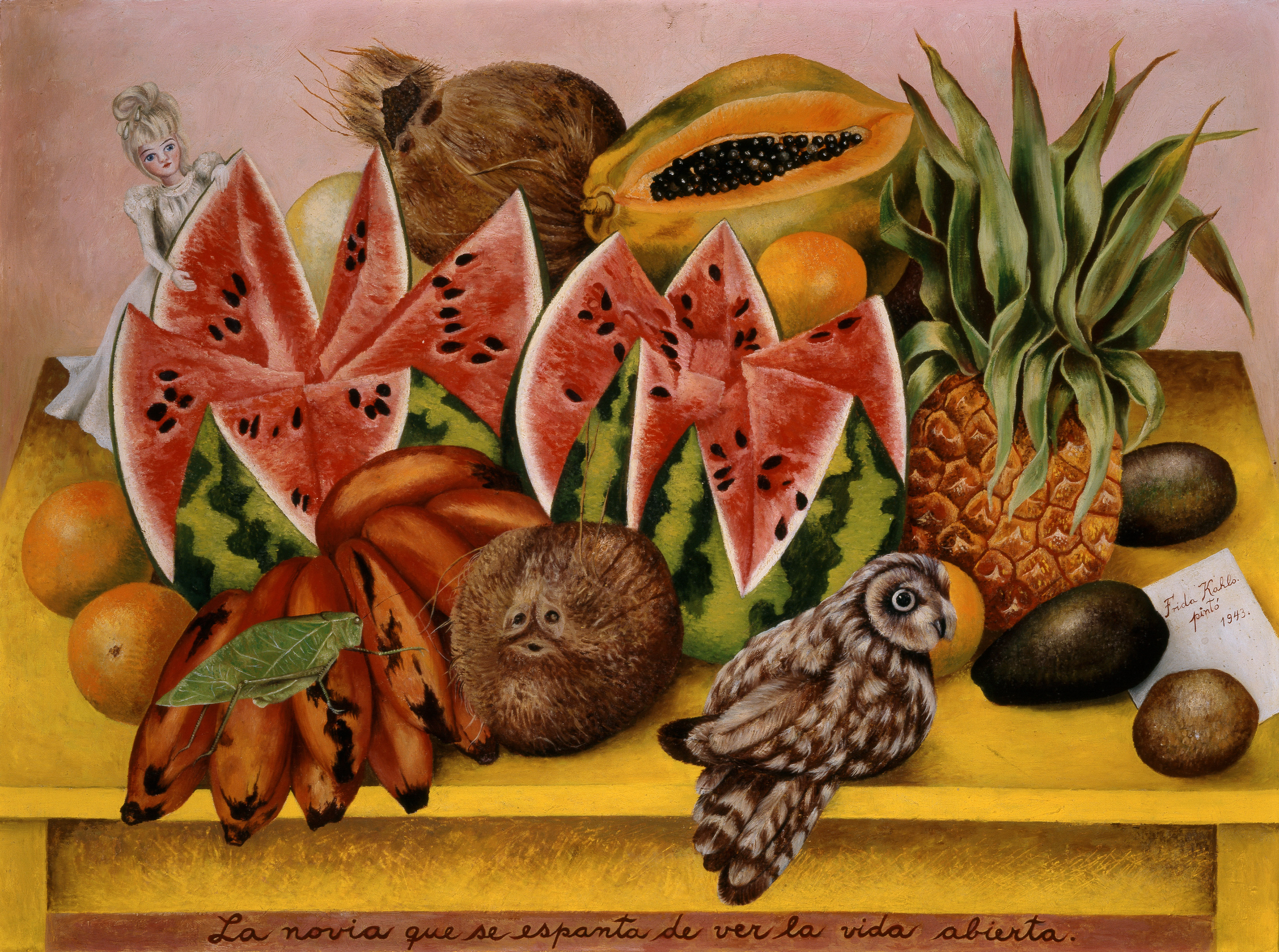 Illustration of Frida Kahlo's "The Bride Who Becomes Frightened When She Sees Life Opened" depicting a doll, an owl, and various fruits on a yellow surface, with text at the bottom and a signature on the right.