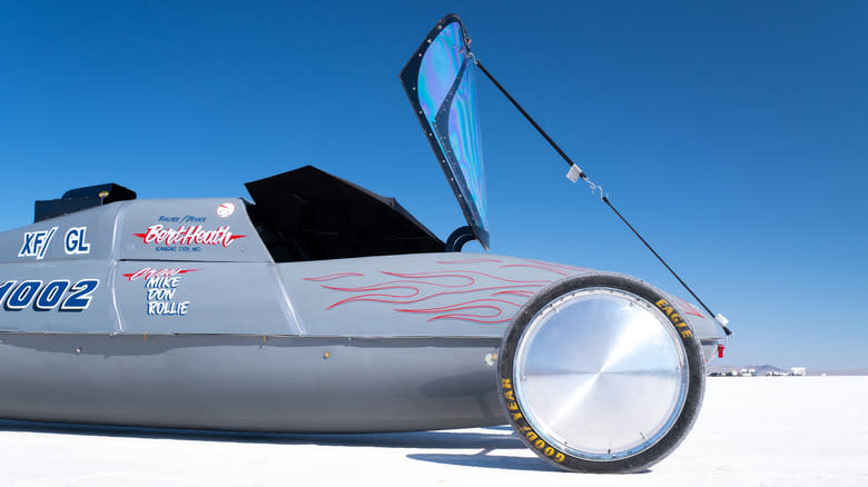A land speed record vehicle parked on Boneville Salt flats with Goodyear tires.