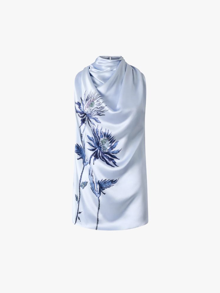 Image may contain: Clothing, Scarf, and Dress