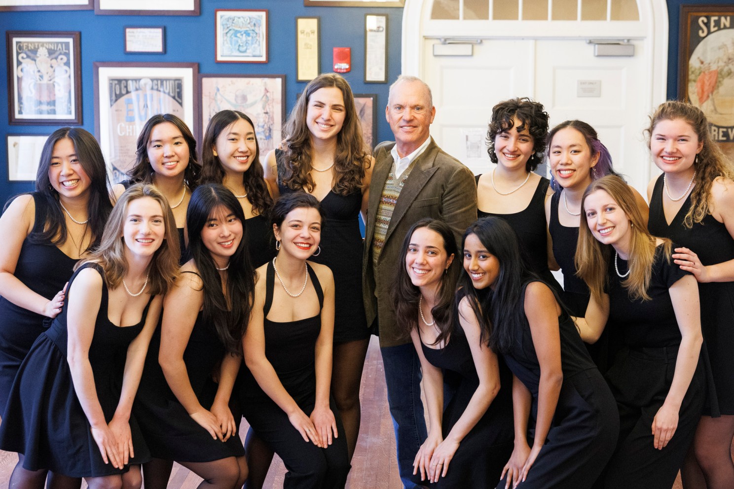 Michael Keaton (center) poses for a photo with the Radcliffe Pitches. 