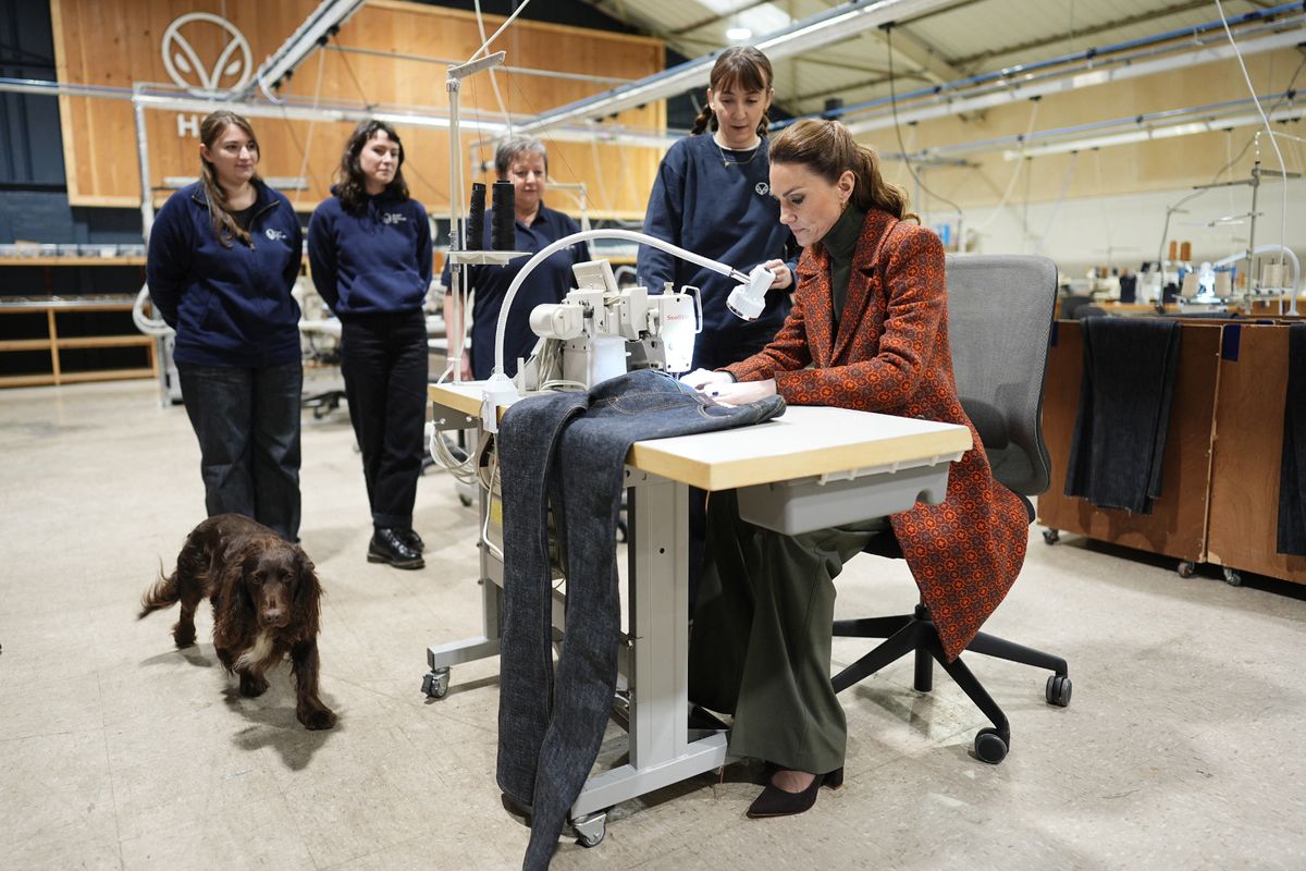 Kate gets to work on a pair of jeans for Prince William