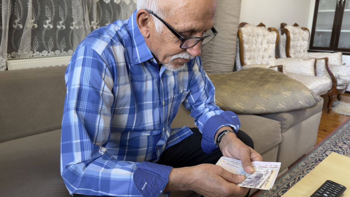 Retired senior man counting money