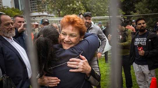 One Nation leader Pauline Hanson hugs a supporter before addressing the crowd at the Put Australia First rally in Melbourne’s Flagstaff Gardens, in November 2025.