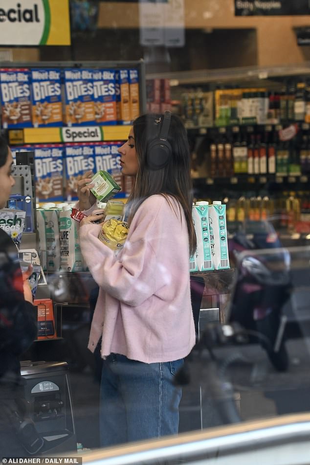 She also popped into a local supermarket to grab an armful of groceries which she will most likely be eating alone in her Sydney apartment
