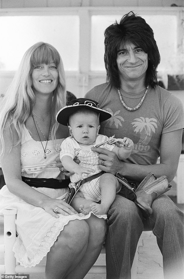Despite being the son of a Rolling Stone, a man with an estimated net worth of £150million, Jesse is scraping by on a modest income and pleading for leniency over a £957 court bill (Jesse pictured as a baby with Ronnie and his then wife Krissy)