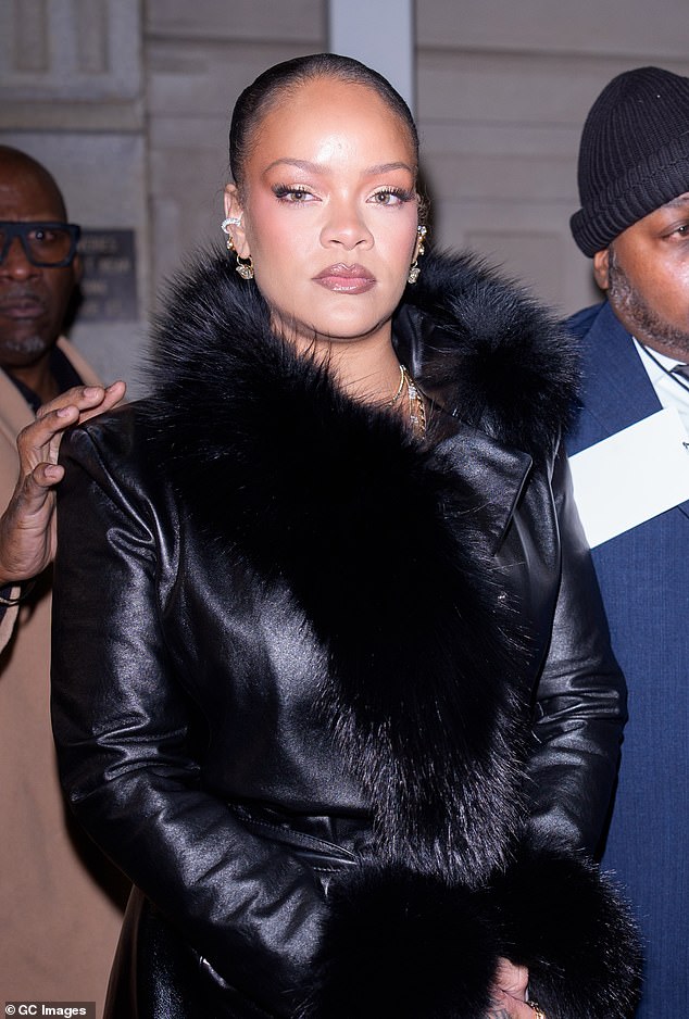 The Savage x Fenty founder exuded confidence in a black leather coat with fur cuffs from Rocky's AWGE Fall 2026 collection along with a coordinating scarf