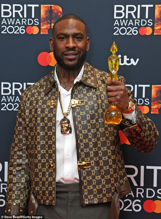 Skepta posed with the Best Dance Act award which he won with Fred Again and PlaqueBoyMax