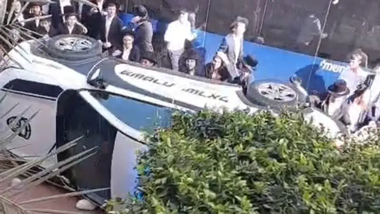 Minor arrested on suspicion of overturning police car in Bnei Brak