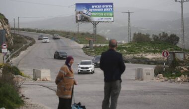 Settlers hang Israeli flags and banners in the Masoudiya neighborhood near the town of Sebastia, north of Nablus, February 13, 2026. (Photo by Mohammed Nasser/APA Images)