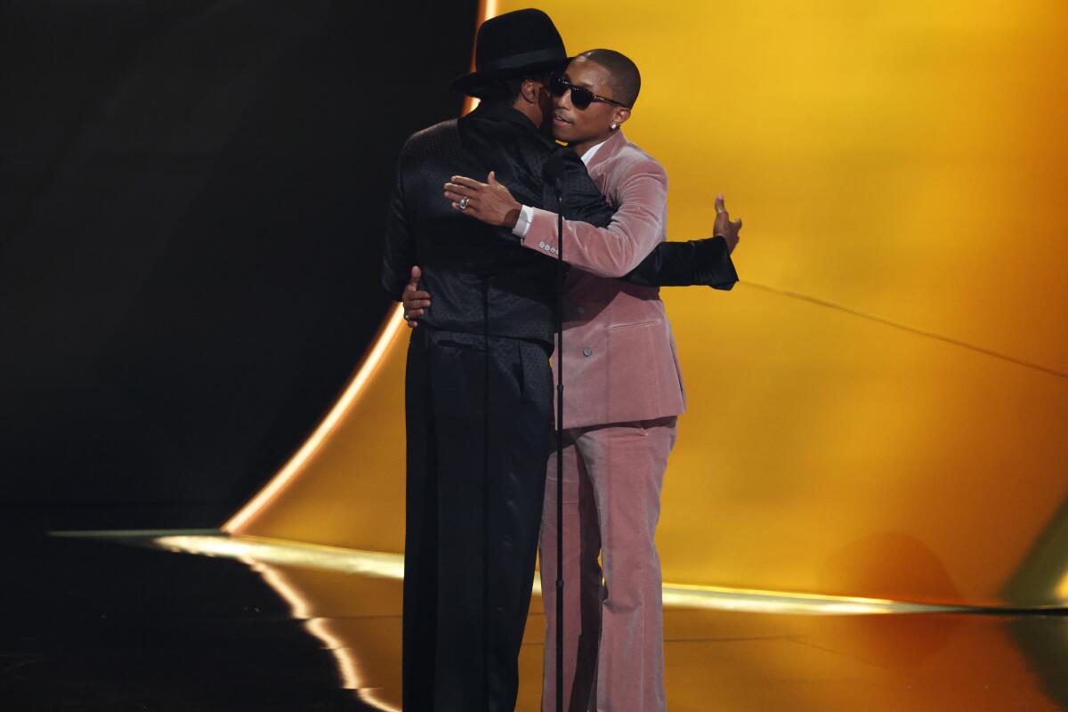 Q-tip and Pharrell Williams on stage at the Grammys