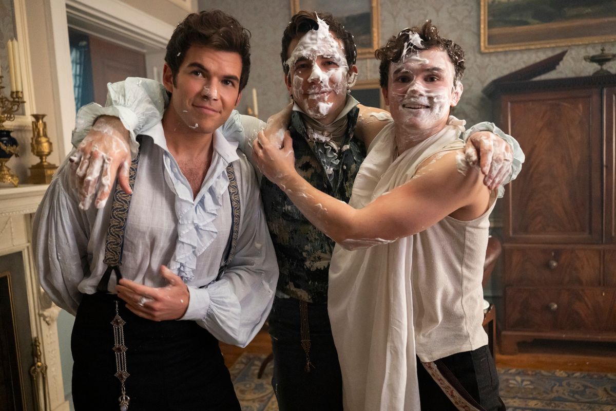 three men with shaving cream on their faces
