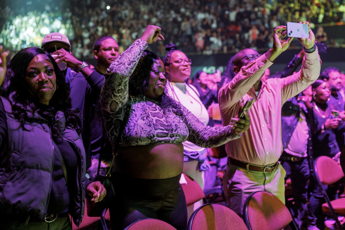 Fans sway to the music as Boyz II Men performs at the Kia Forum 