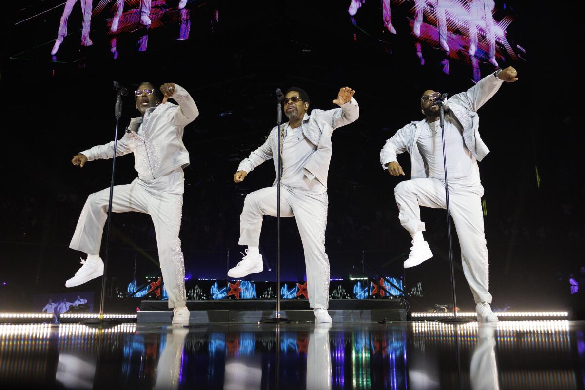 Boyz II Men dance in unison at the Kia Forum.