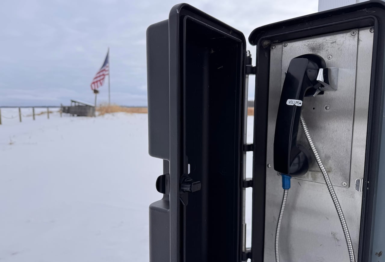 black telephone in a box outside