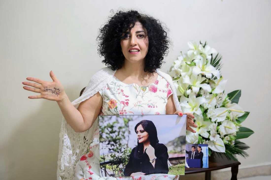 FILE - In this photo released by the Narges Foundation Archive, Nobel Peace Prize laureate Narges Mohammad is seen after being released on a medical furlough in Tehran, Iran, Wednesday, Dec. 4, 2024. On her hand written in Farsi is "End gender apartheid."
