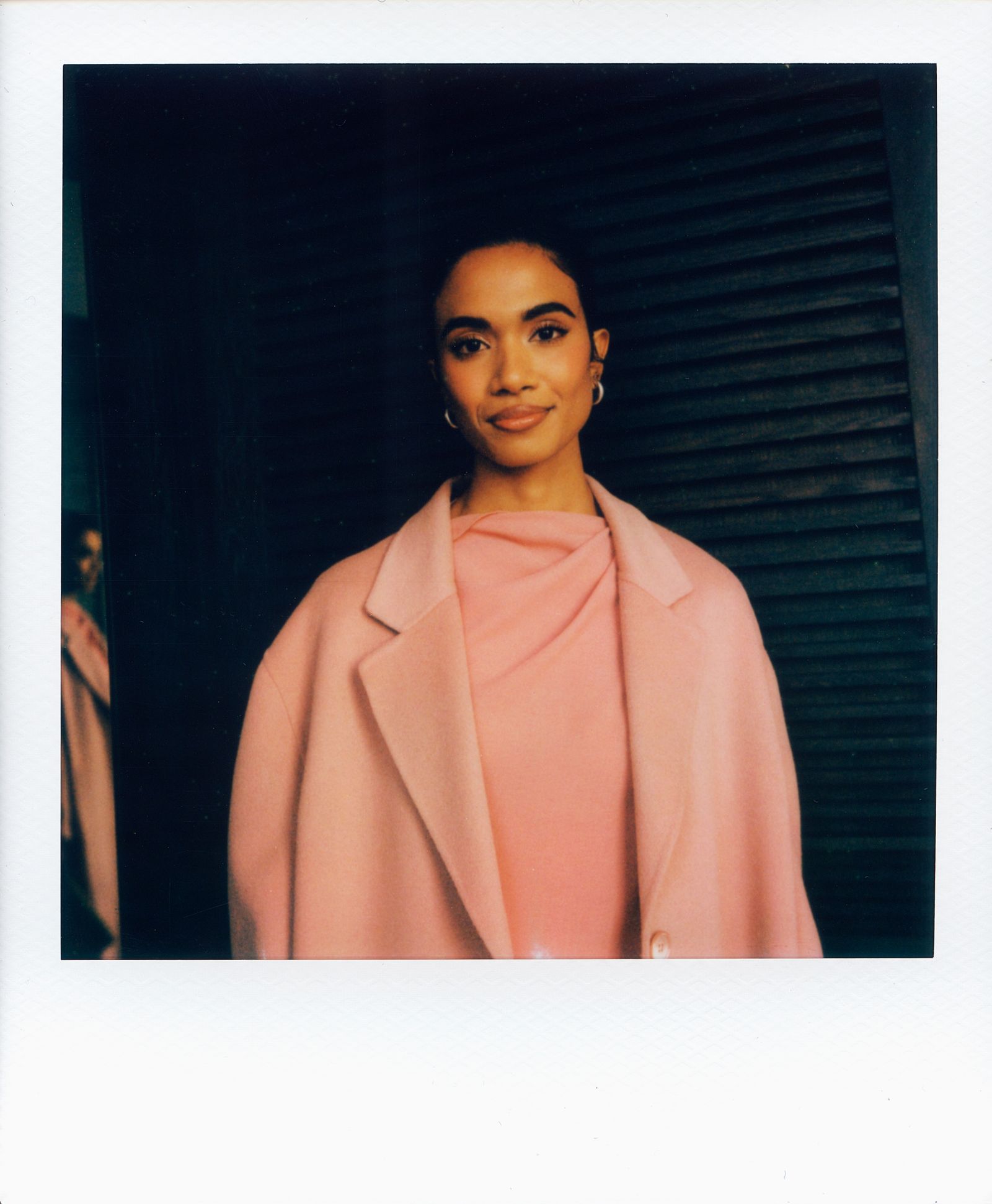 Image may contain Face Head Person Photography Portrait Clothing Coat Blazer Jacket Happy Smile and Adult