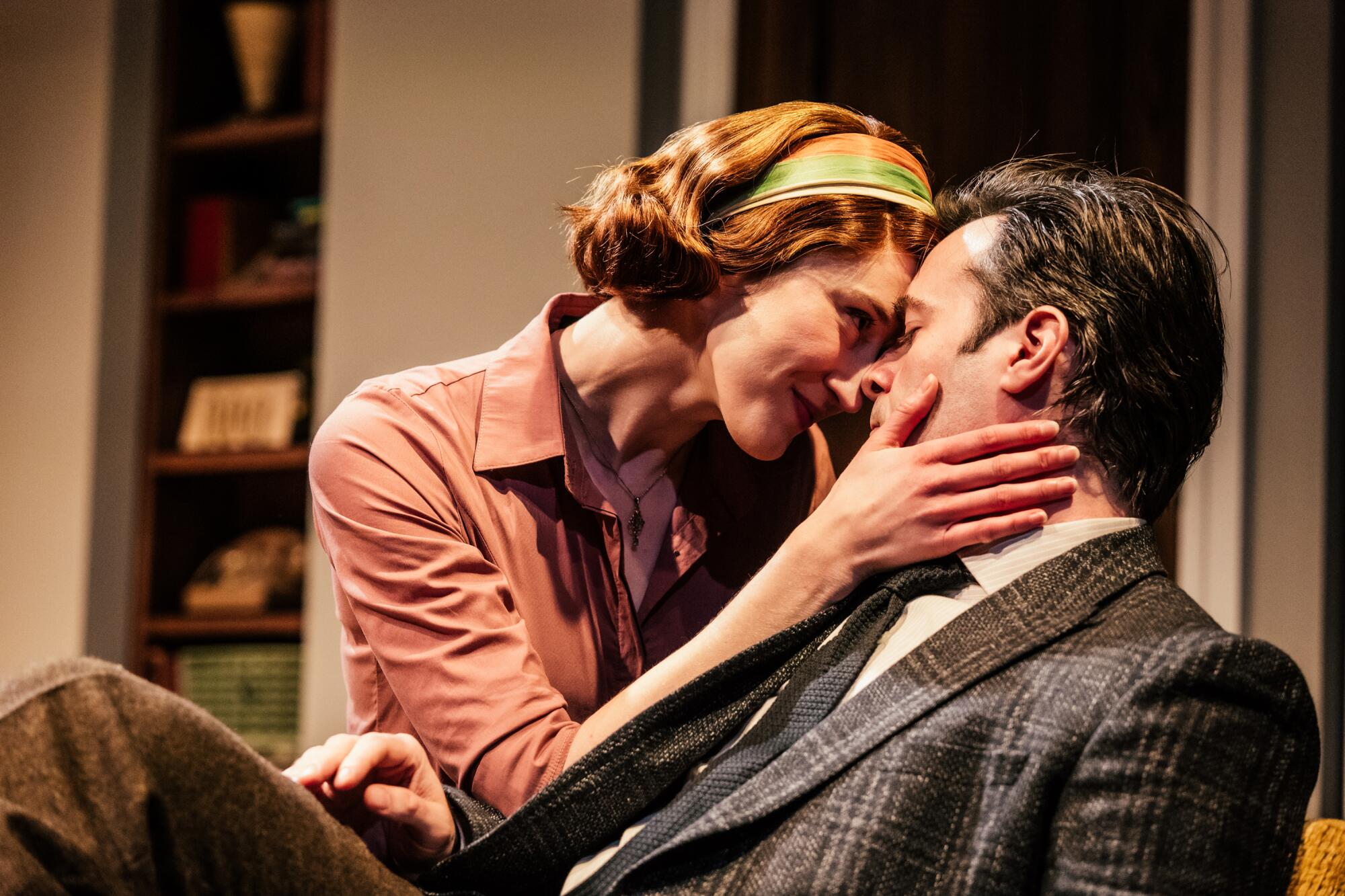 A woman and a man embrace onstage at Geffen Playhouse.