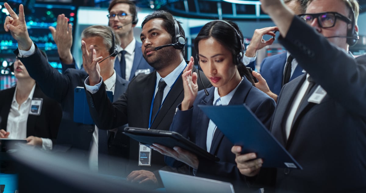 A group of stock traders on a trading floor.