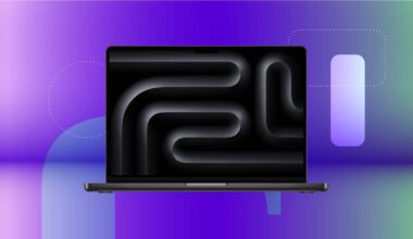 An open laptop with a black screen is featured against a purple CNET background.