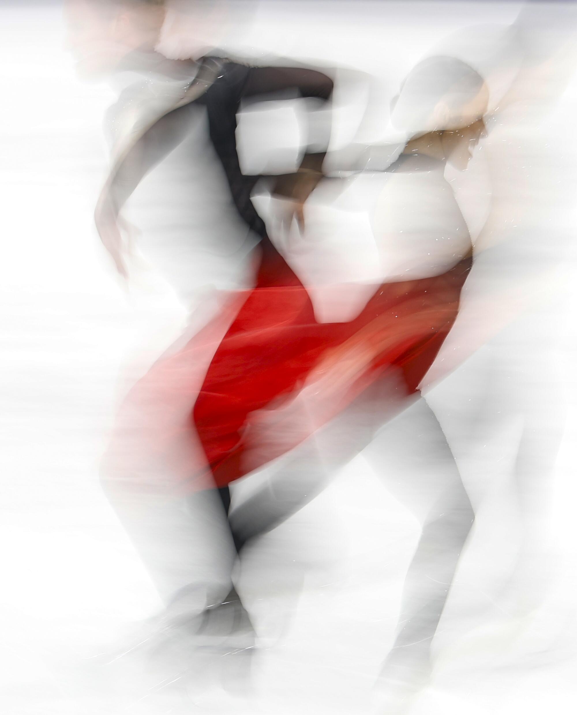 Madison Chock and Evan Bates practice before competing in the ice dancing free skate competition.