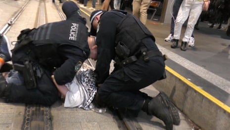 NSW police punch person multiple times during Sydney anti-Herzog protest – video