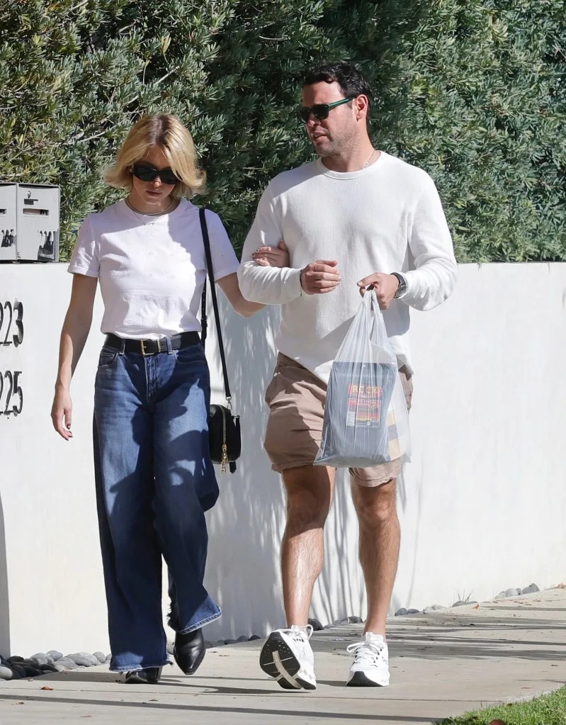 As for Braun, he wore a white long-sleeve shirt and shorts. BACKGRID