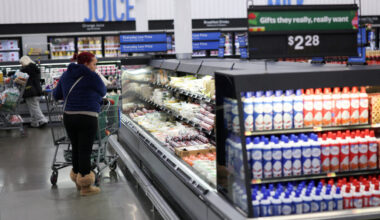 FILE PHOTO: Customers shop for groceries at Walmart Supercenter retail store in North Bergen, New Jersey