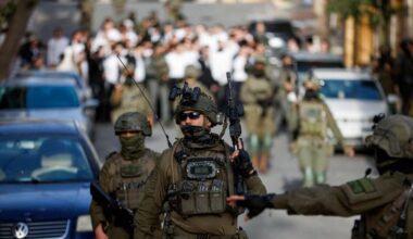 Israeli soldiers walk in front of a group of Israeli settlers, during “a weekly tour”, in Hebron, in the Israeli-occupied West Bank, January 31, 2026.