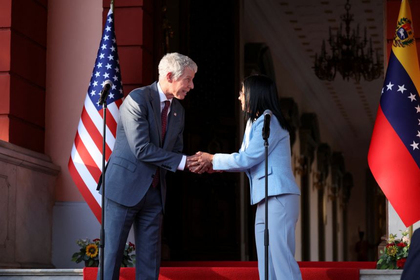 Venezuela's acting President Delcy Rodriguez and US Energy Secretary Chris Wright shake hands after attending a meeting in Caracas, Venezuela, February 11, 2026.