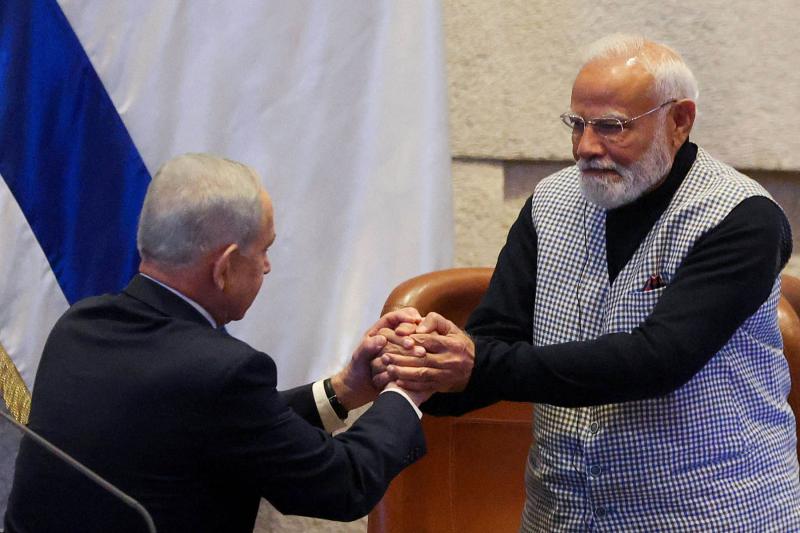 Israeli Prime Minister Binyamin Netanyahu greets India’s Prime Minister Narendra Modi, during a special session of the Knesset, Israel’s parliament, in Jerusalem February 25, 2026.