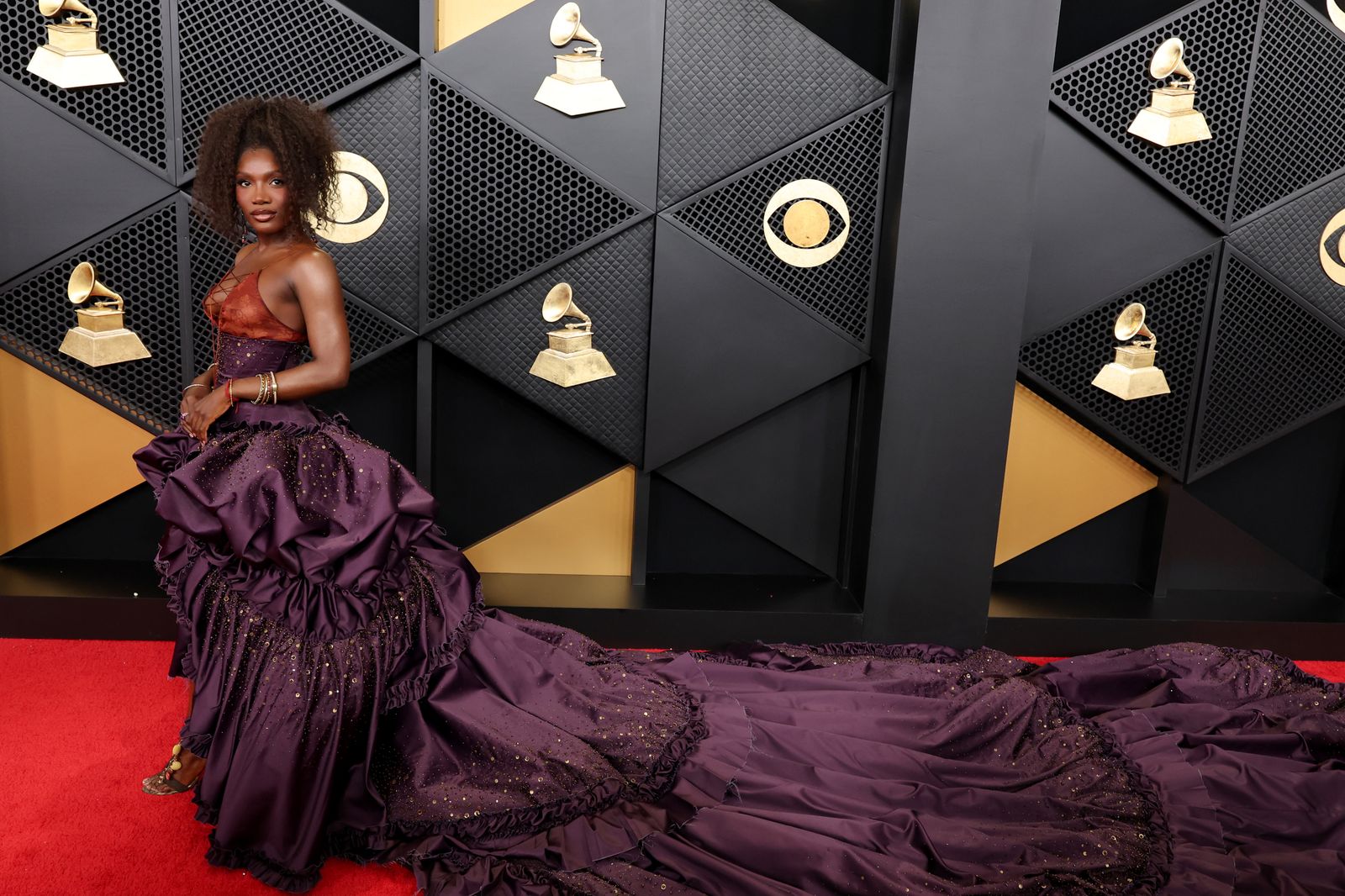 Image may contain Clothing Dress Formal Wear Fashion Gown Dressing Room Indoors Room Interior Design and Furniture